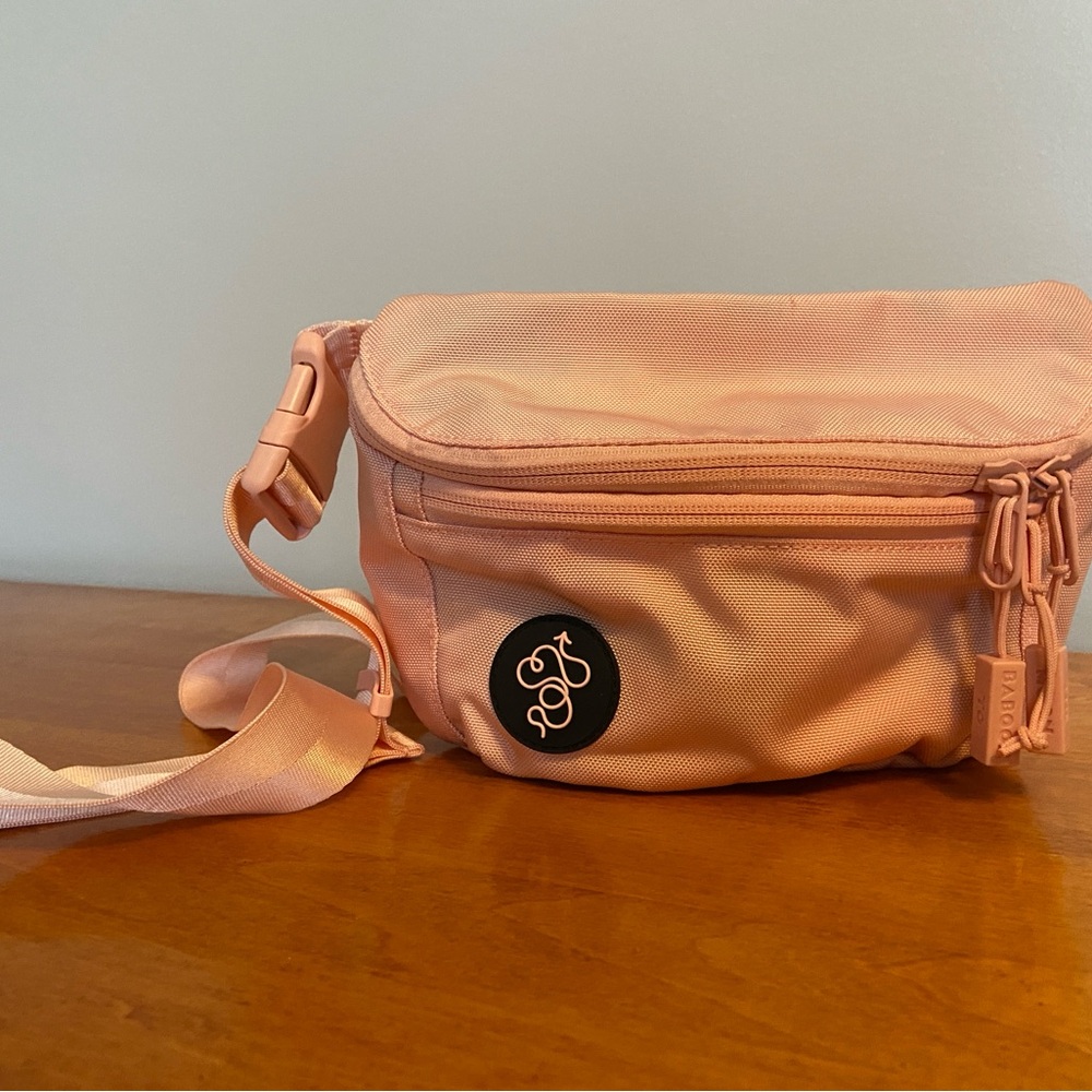 Baboon to the Moon fanny bag is light pink